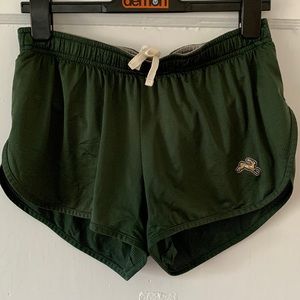 Tracksmith Twilight split shorts in forest green